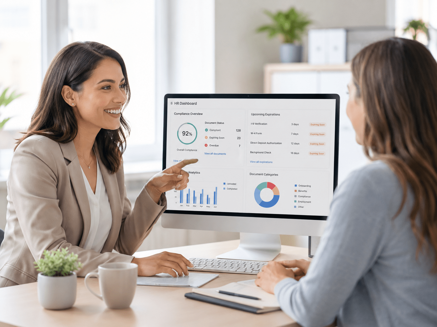 HR Compliance Dashboard HR manager reviewing employee compliance dashboard.