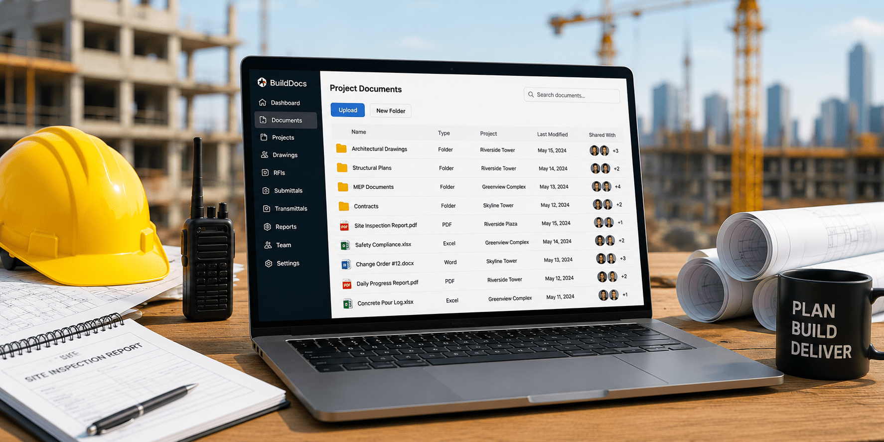 Construction project documents managed on a laptop.